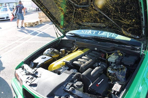 Car with hood open for electrical diagnostics