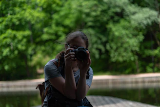 a woman holding a camera