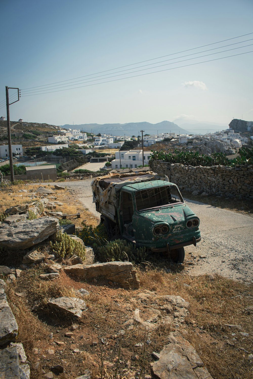 a car parked on a dirt road