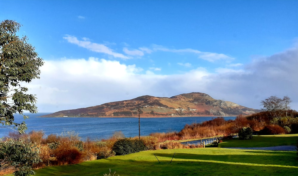 a golf course next to a lake