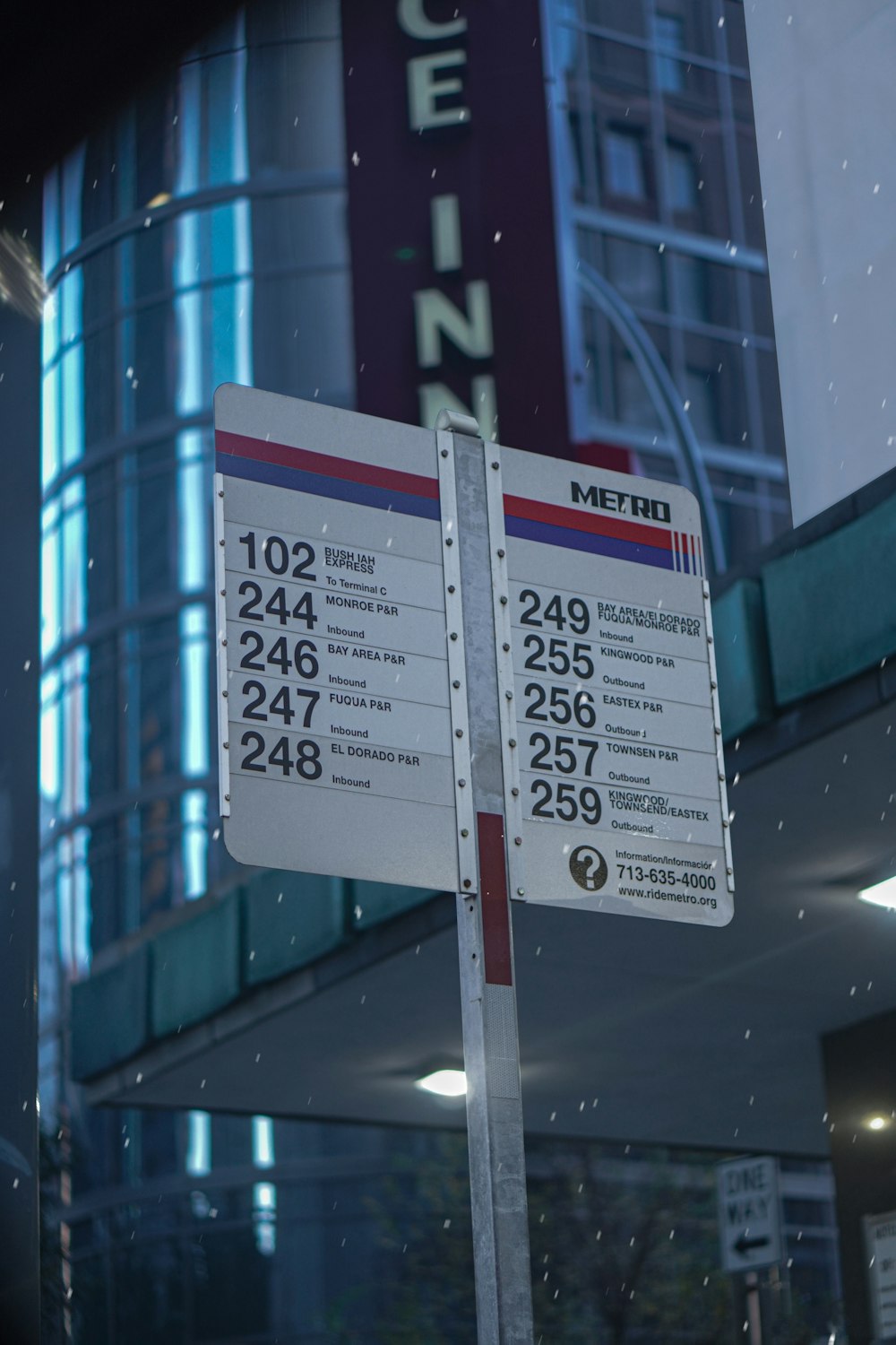 a street sign is posted on a pole