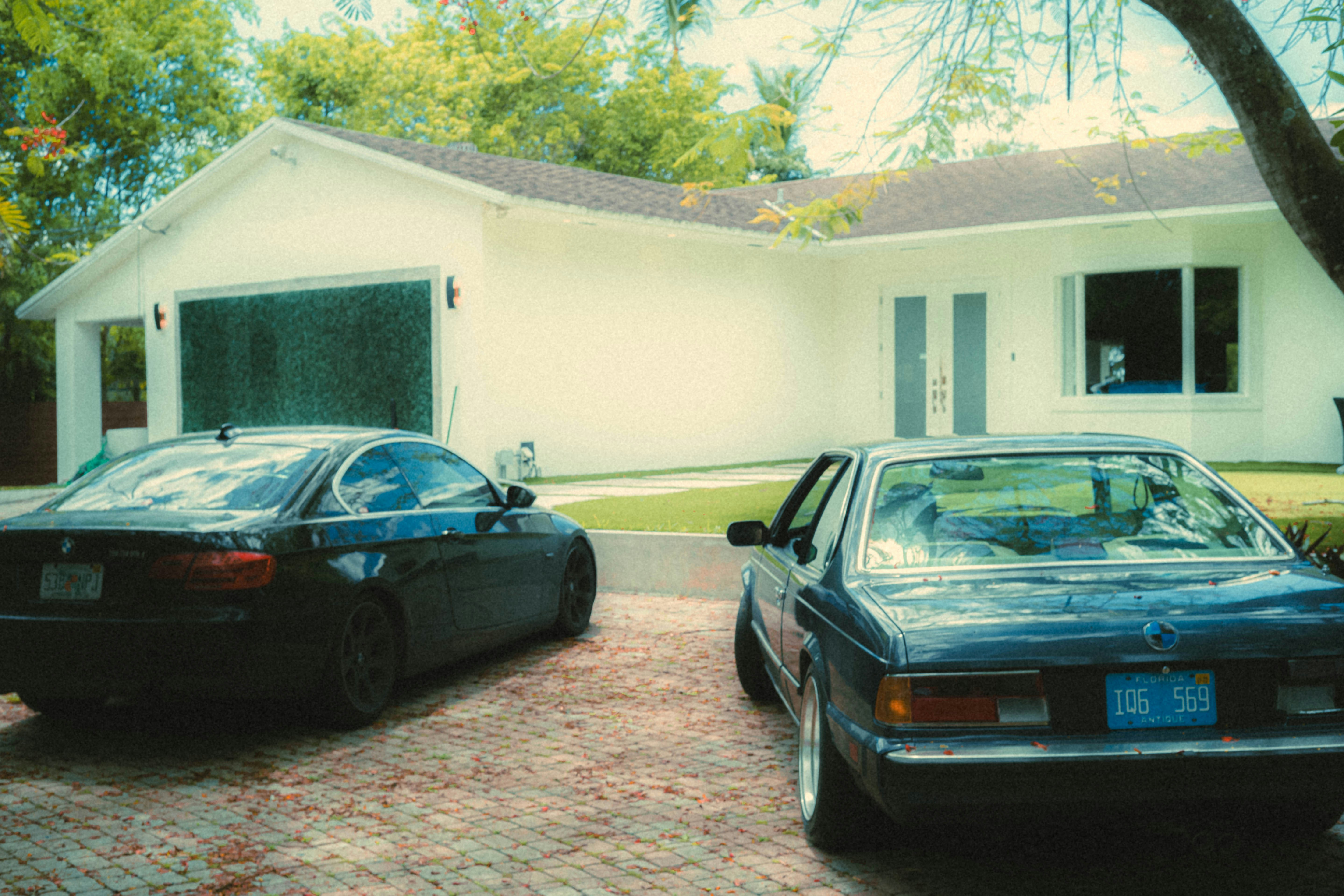a car parked in a parking lot in front of a house