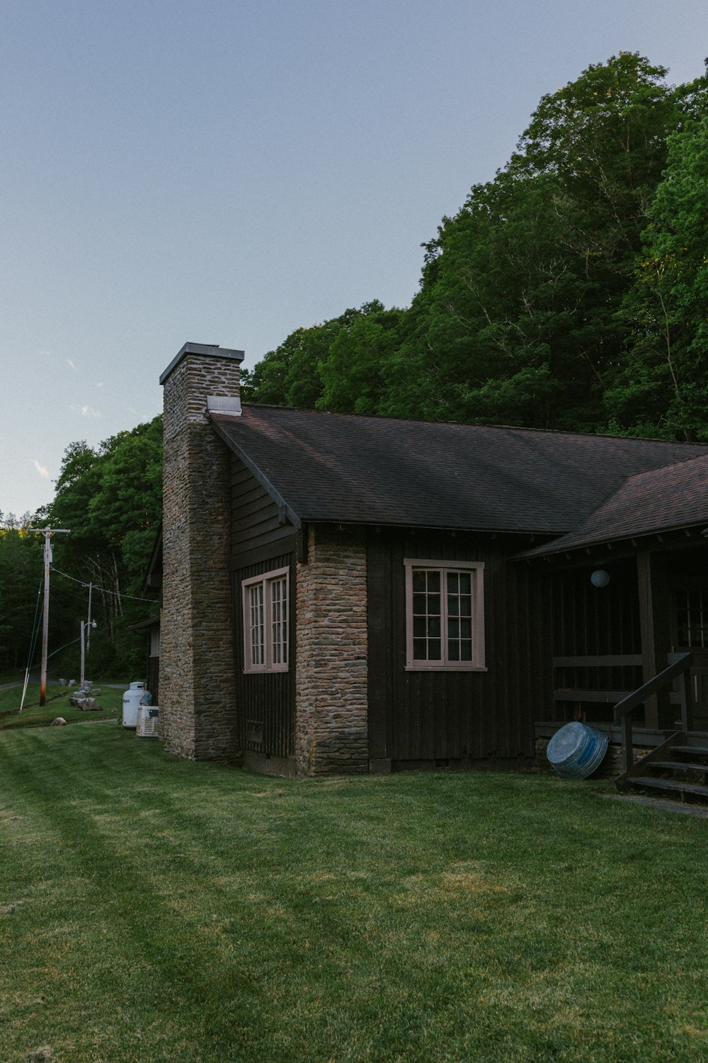 a brick house with a grass yard