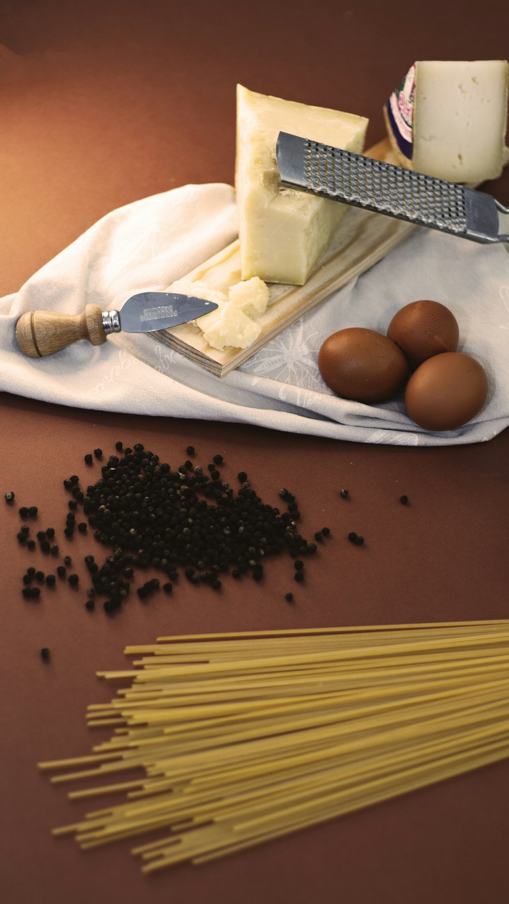 a cutting board with eggs and a knife on it