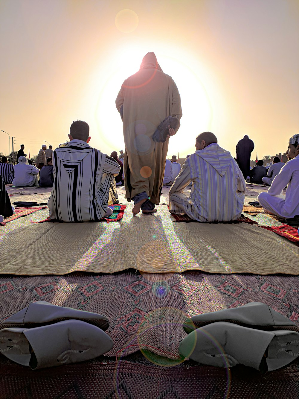 a group of people sitting on the ground