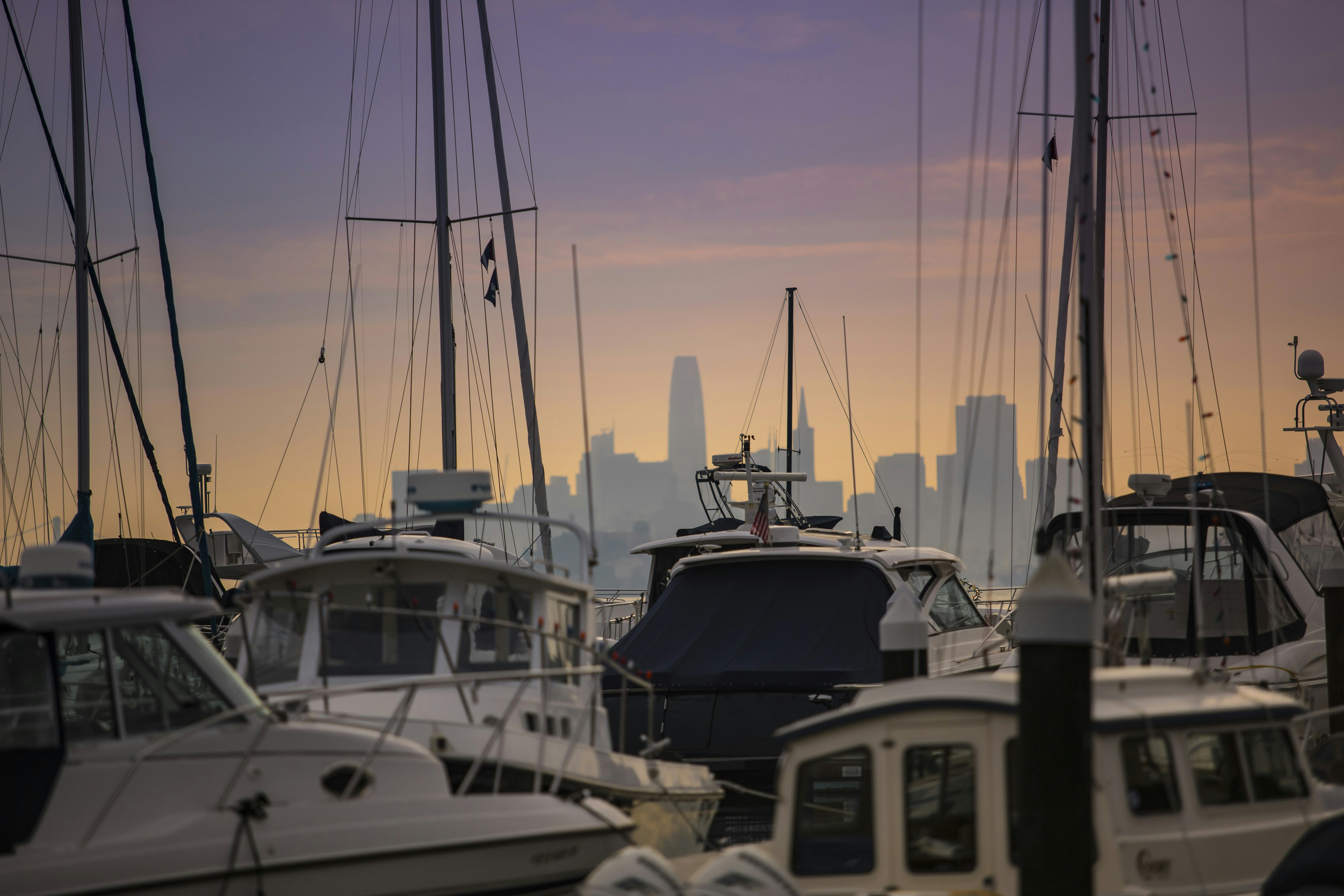 A group of boats sit in a harbor photo – Free Brown Image on Unsplash