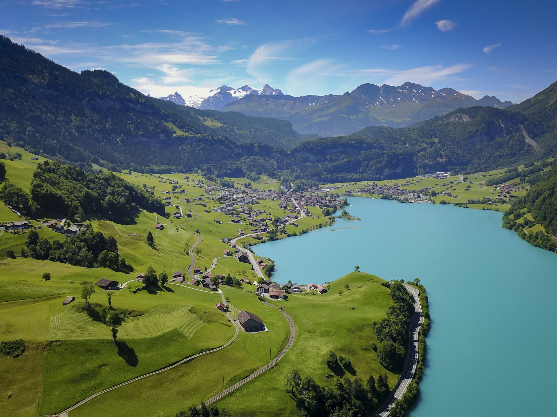 a lake surrounded by mountains and trees