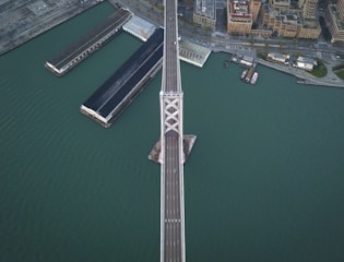 Aerial view of a large infrastructure bridge inspection in progress.