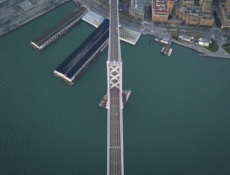 Aerial view of a large infrastructure bridge inspection in progress.