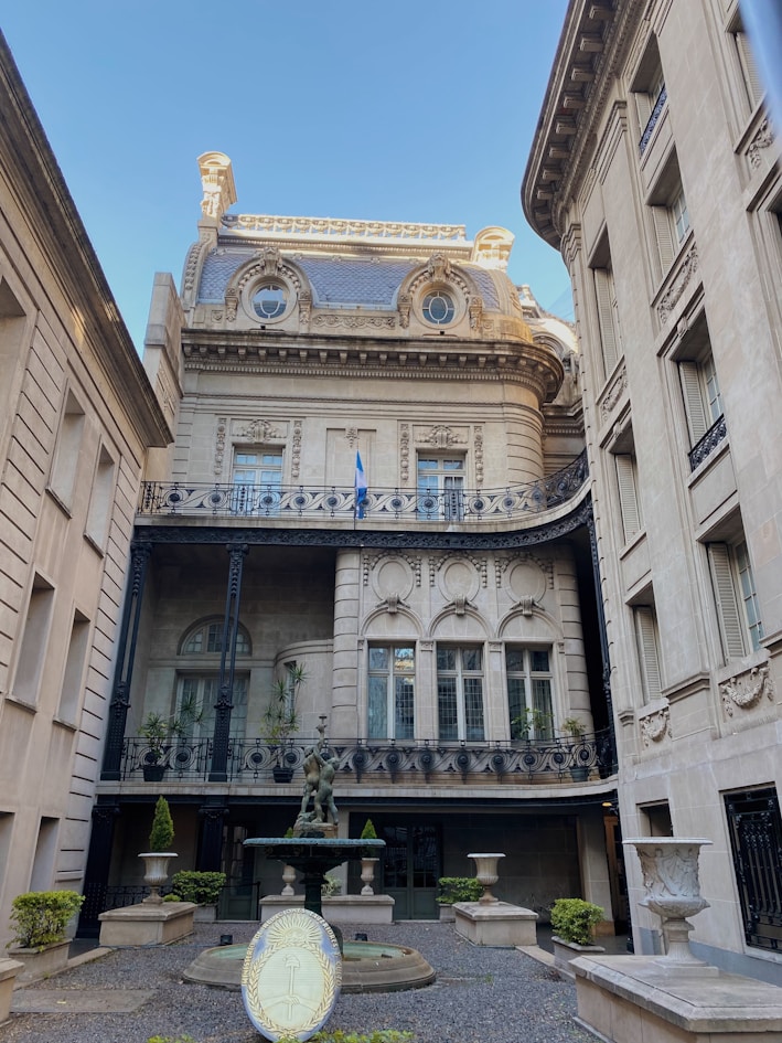 a building with a fountain in front