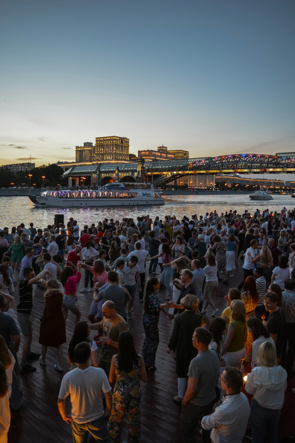 a crowd of people at a dock