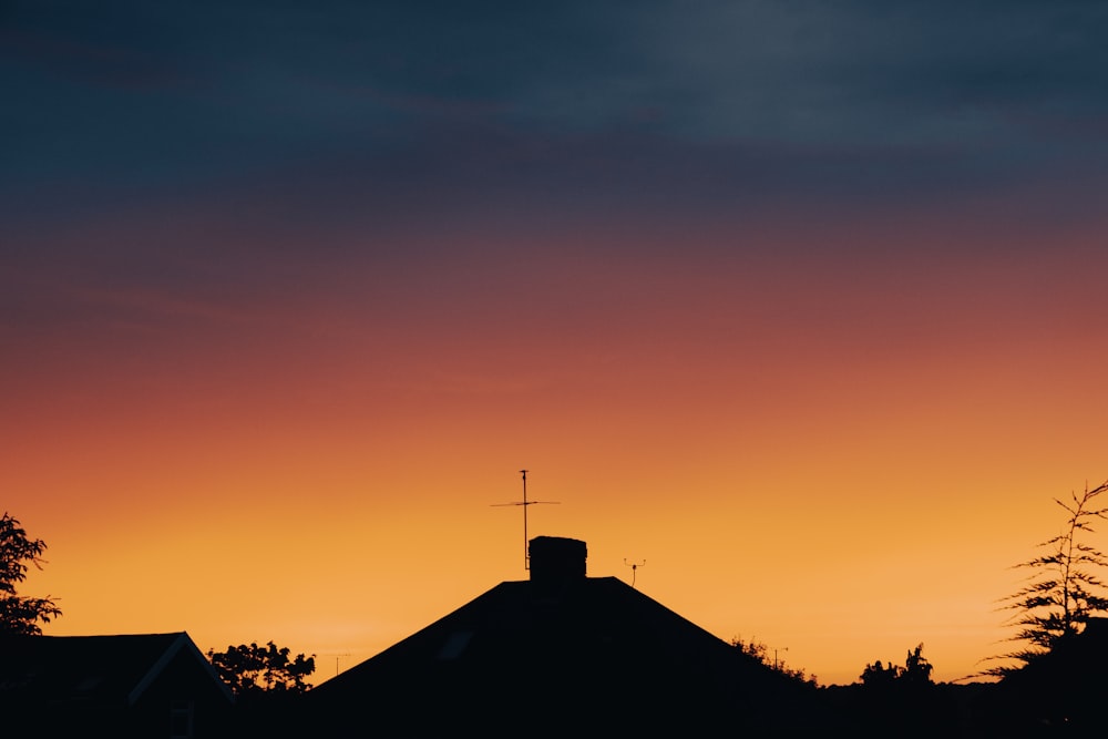 a sunset over a house