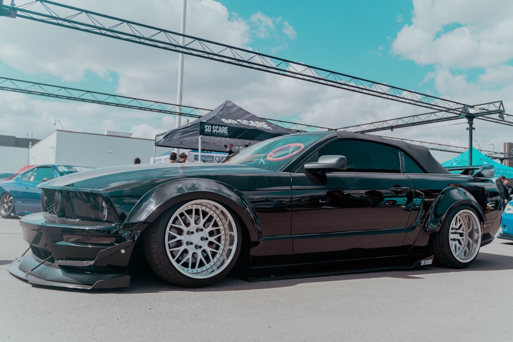 a black car parked in a showroom