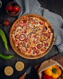 a pizza with tomatoes and onions