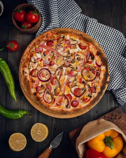 a pizza with tomatoes and onions
