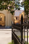 a gate with a building in the background