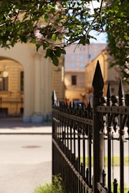 a gate with a building in the background