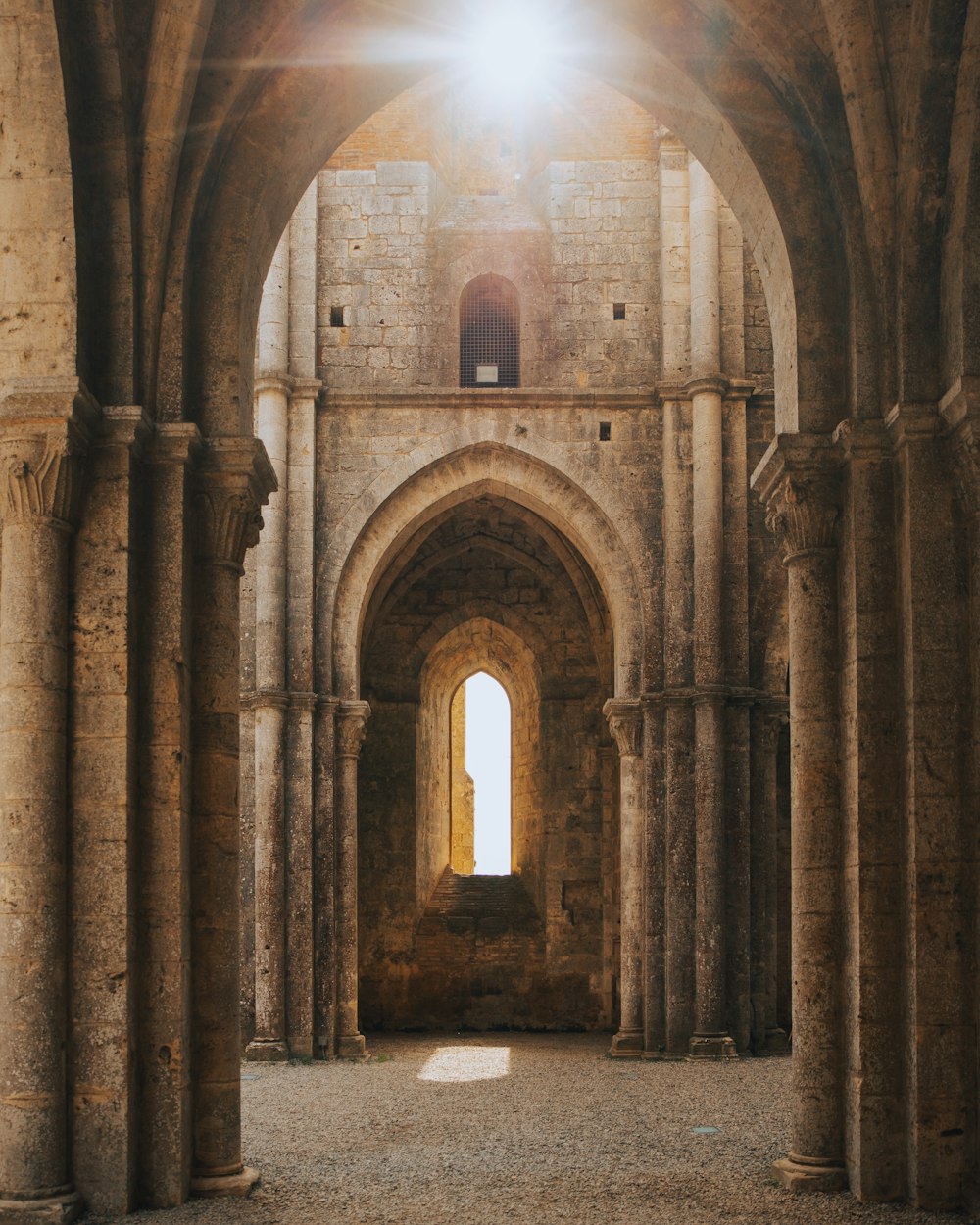 a large stone building with arched doorways