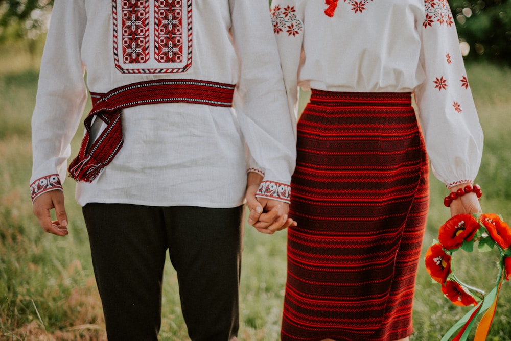 a couple of people wearing matching outfits