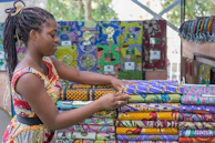 a person holding a colorful kite