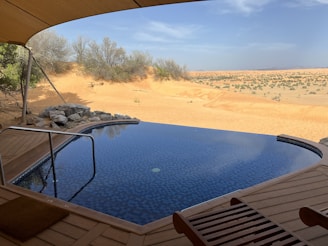 a pool in a sandy area