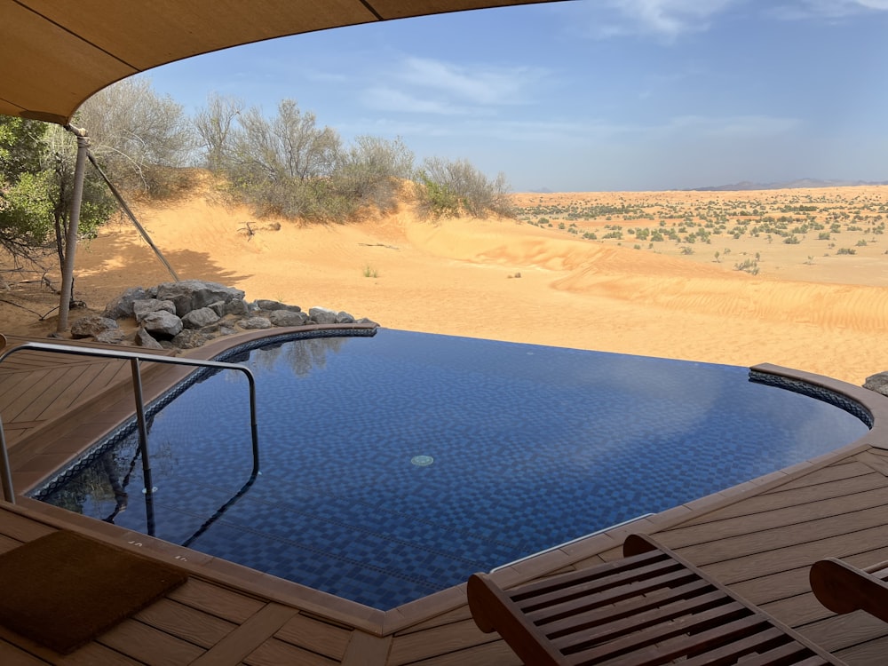 a pool in a sandy area