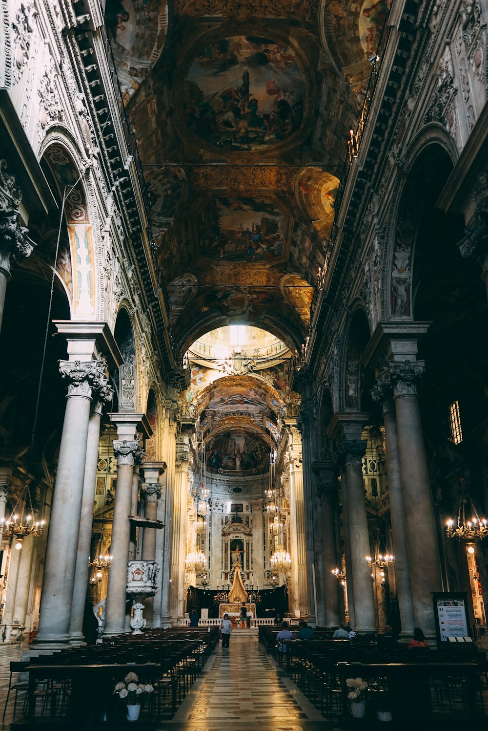 a large ornate building with columns and statues