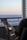 A couple relaxing on the balcony with ocean views.