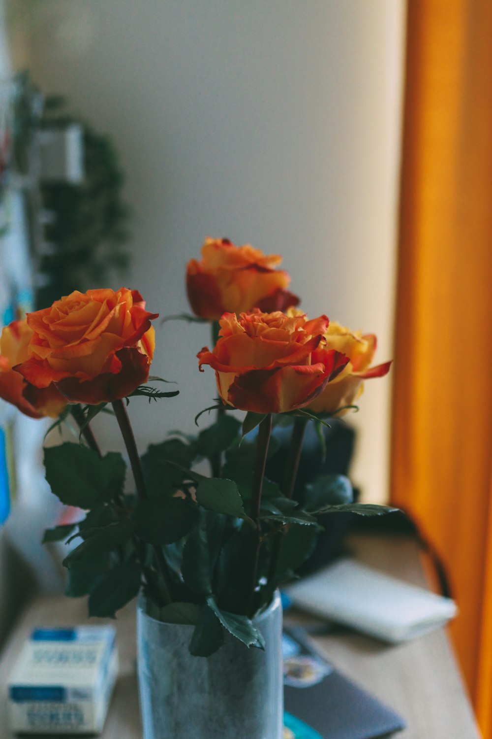 a vase with orange flowers