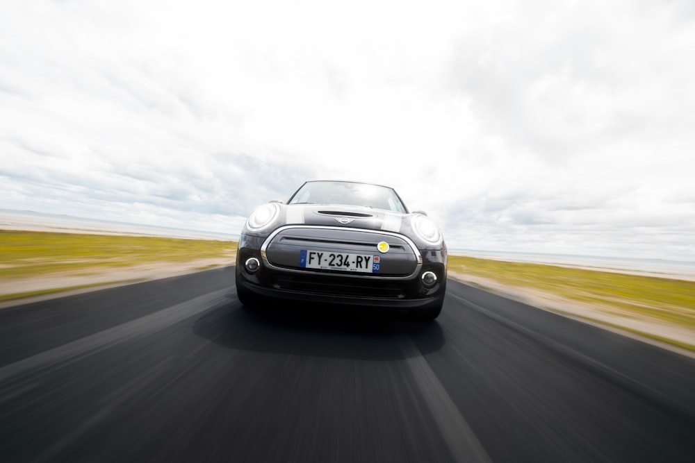 a black sports car on a road