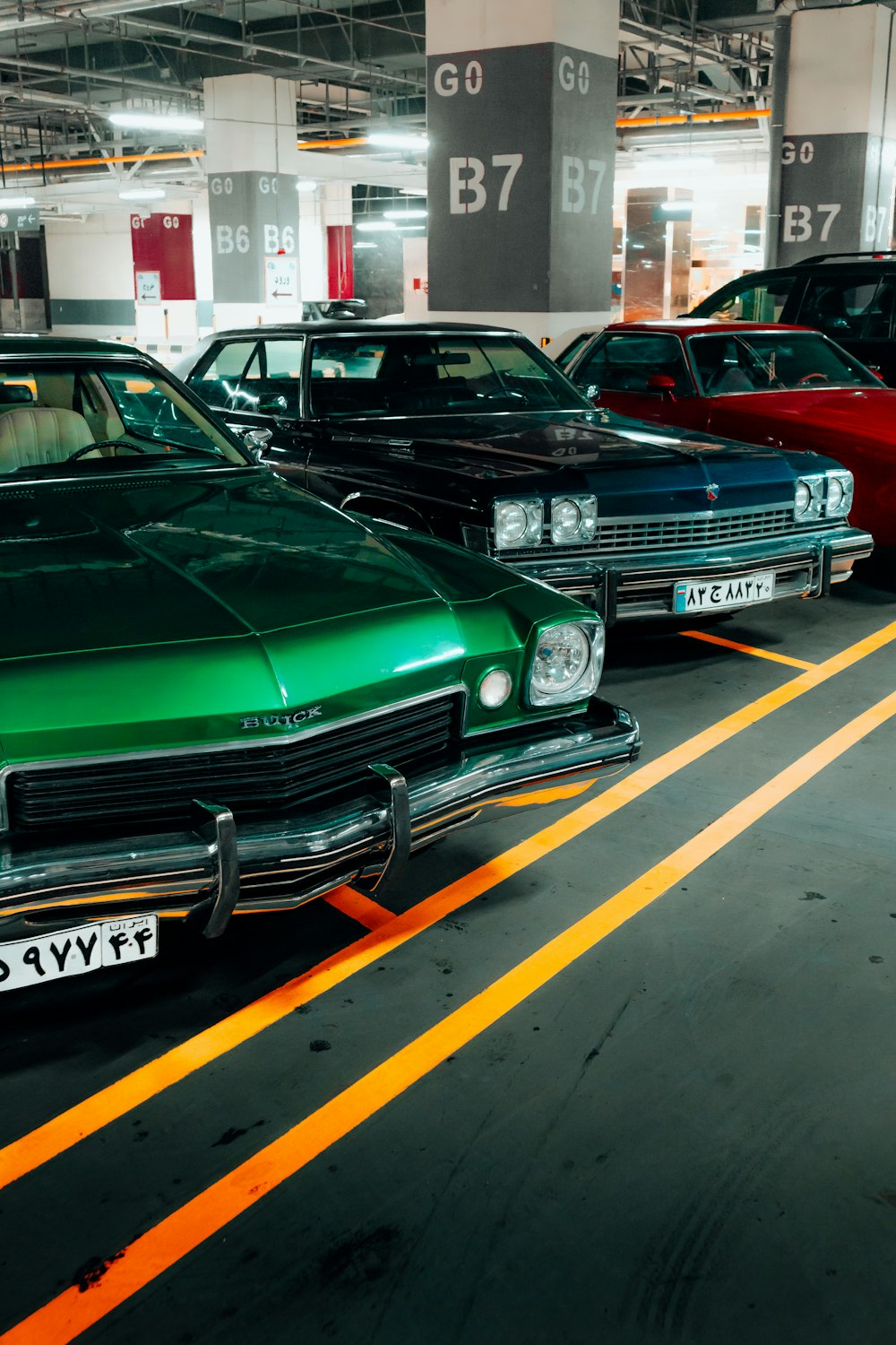 a row of cars parked in a parking lot