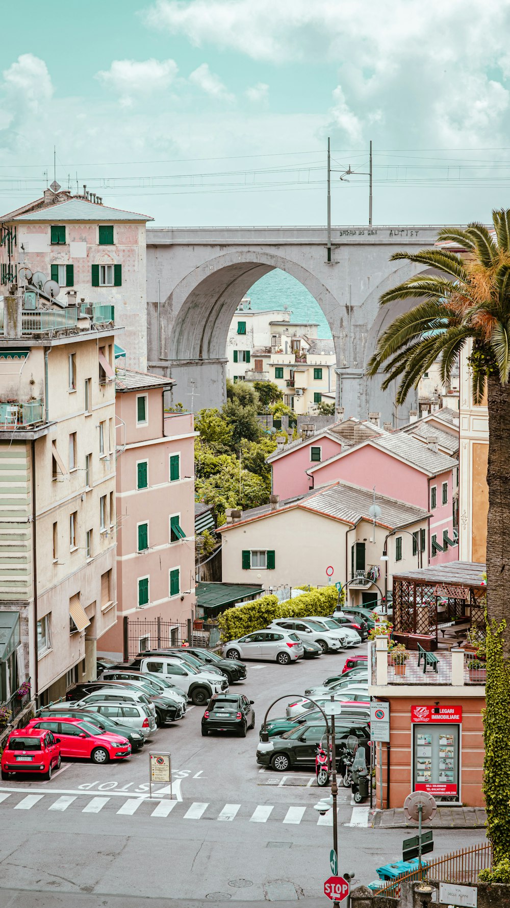 a road with cars and buildings on the side