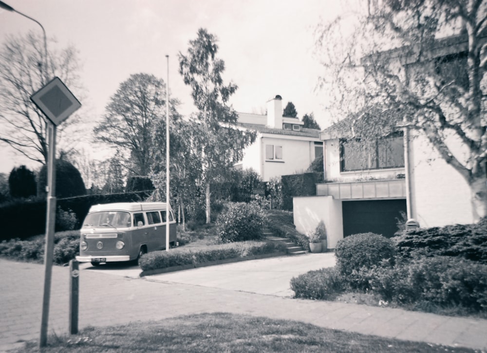 a van parked in front of a house