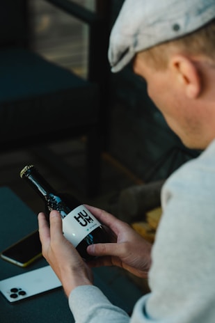 a person holding a bottle