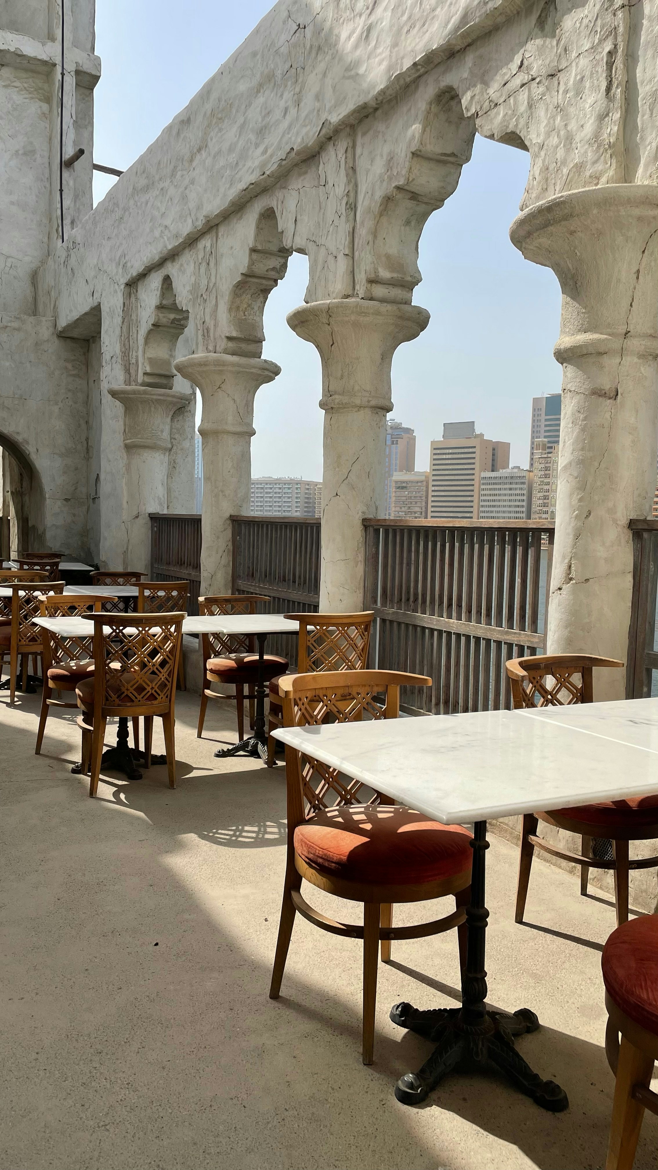 Casa Bianca outdoor seating area by Biba Construction, custom built outdoor dining space with timber and stone