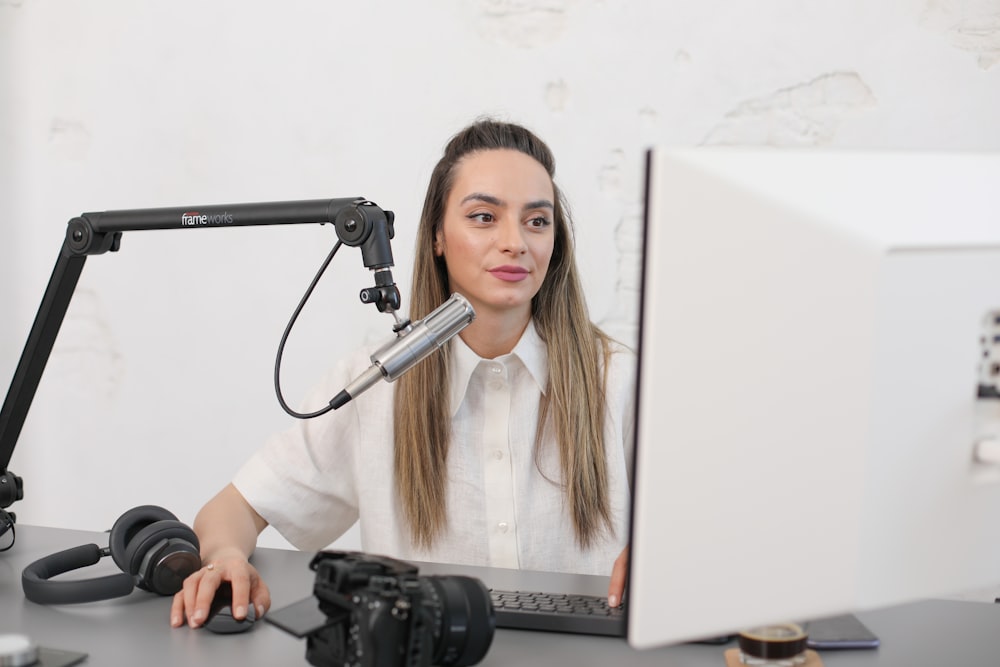 a person sitting behind a microphone