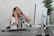 Close-up of a woman listening to music with headphones in a creative workspace.