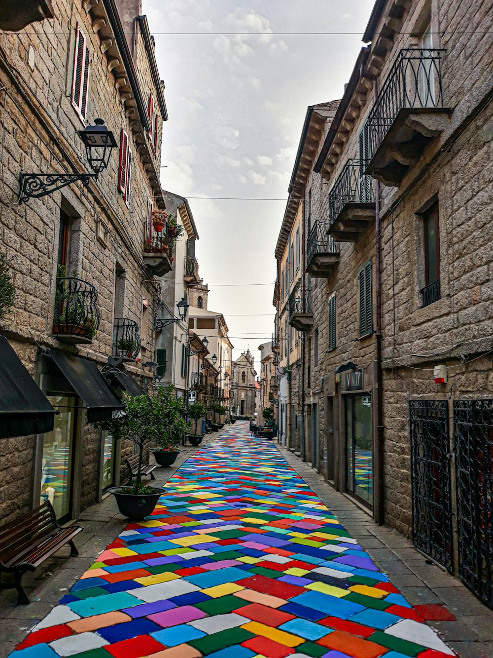a colorful rug on a street