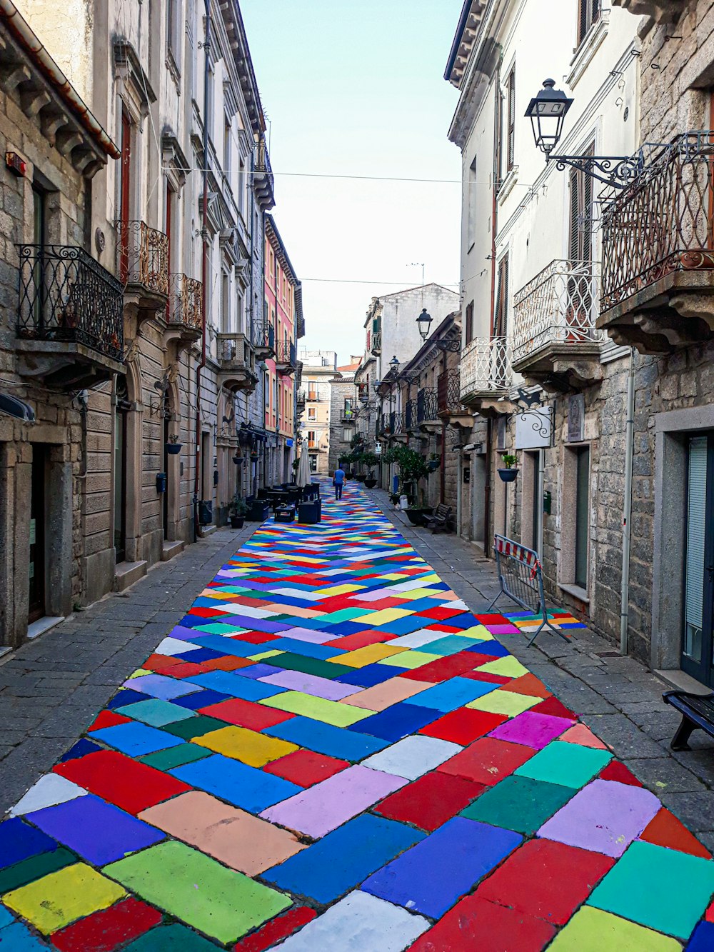 a colorful rug on a street