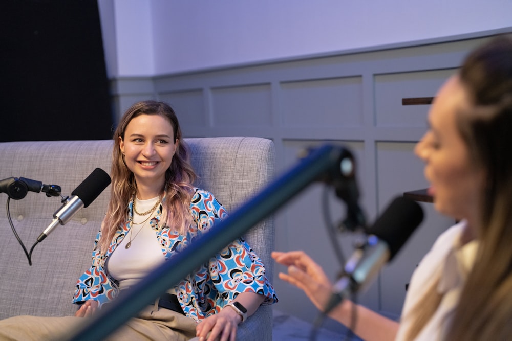 a woman speaking into a microphone