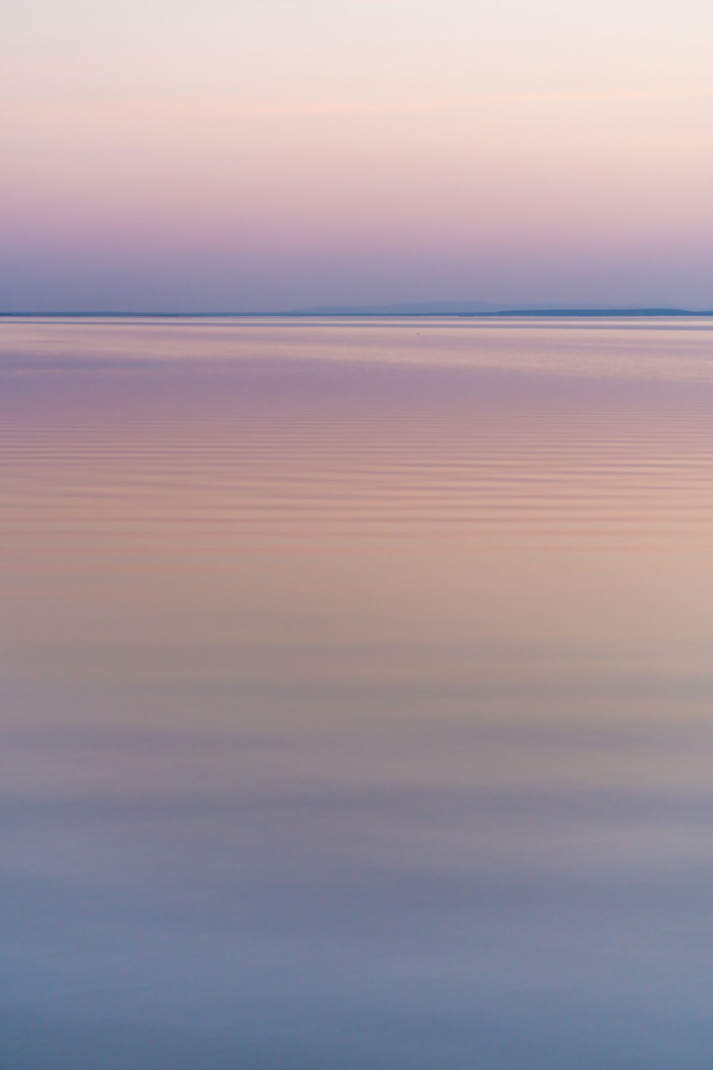 a body of water with a sunset