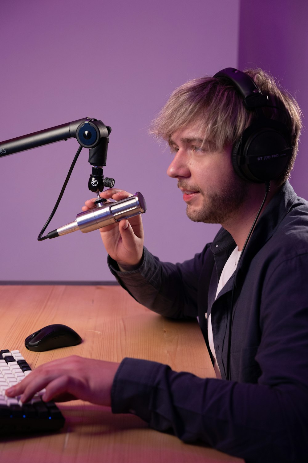 a person wearing headphones and using a microphone