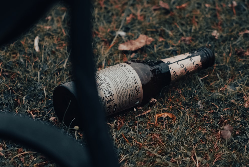 a bottle of wine on a persons leg