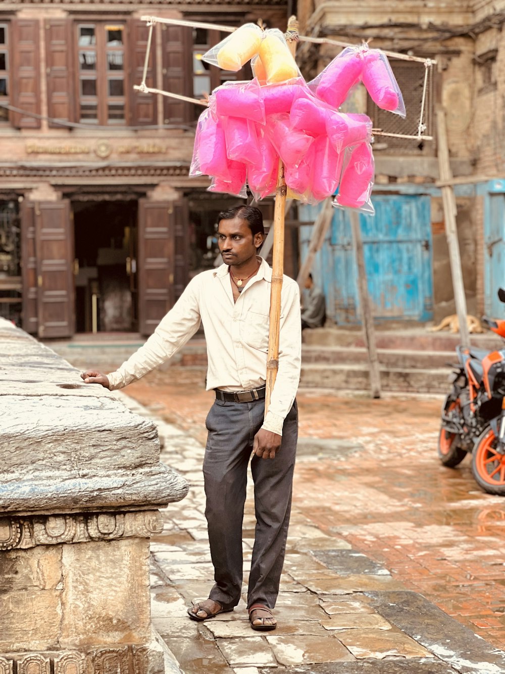 a person holding a pink umbrella