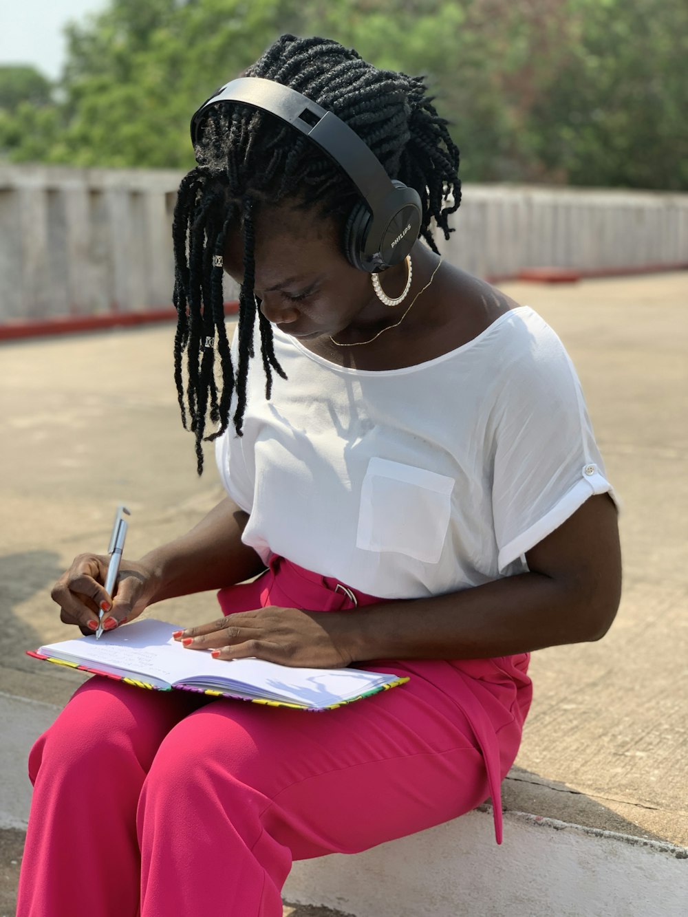 a woman writing on a book