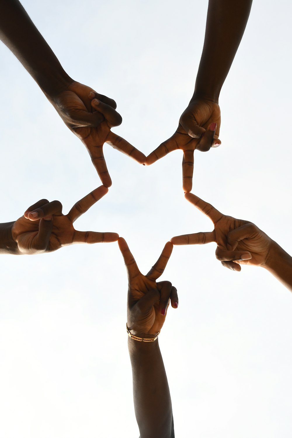 a group of people holding hands