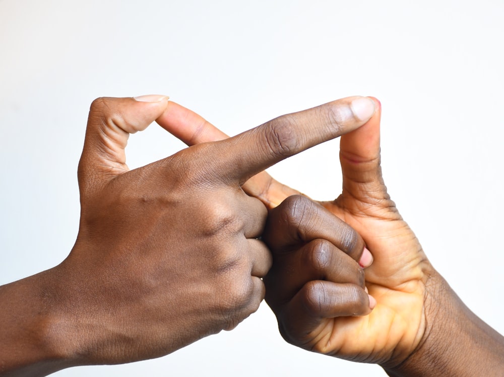 a close-up of hands holding each other