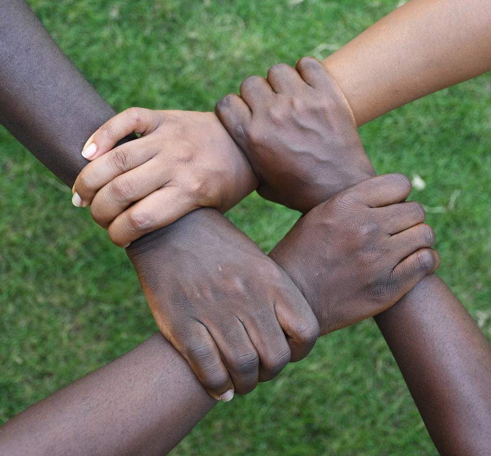 a group of hands holding each other