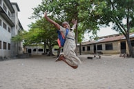 a man holding a child on his back