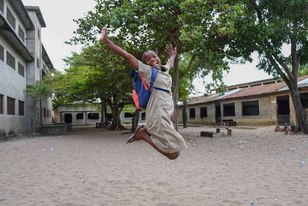 a man holding a child on his back